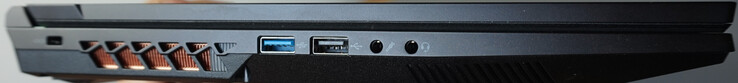 Esquerda: trava Kensington, USB-A (5 Gbit/s), USB-A (0,5 Gbit/s), microfone, fone de ouvido