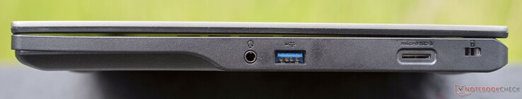 À direita: Conector de áudio, USB-A 3.2 Gen1 (5 GBit/s), leitor de cartão microSD, trava Kensington